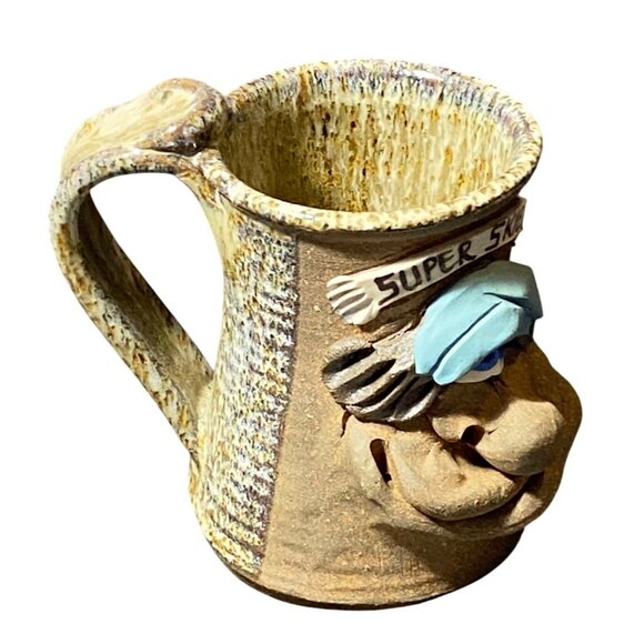 Handmade Ceramic Mug With Comical Super Skier Design & Blue Hat - Picture 5 of 7